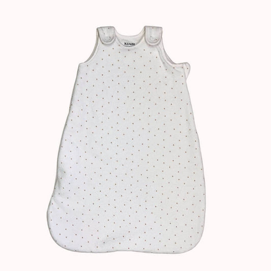  Gigoteuse blanche à pois pour bébé 0/3 mois, avec boutons-pression aux épaules et fermeture éclair sur le côté.