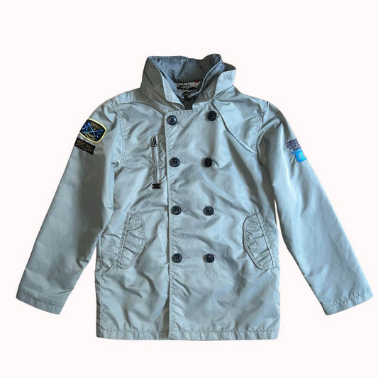  Veste doublée kaki clair Catimini garçon 10 ans, avec capuche escamotable, fermeture zippée et boutonnée, écussons sur les manches.