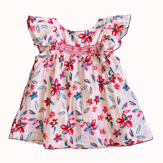 Robe d’enfant en tissu crêpe à motifs floraux colorés, avec manches volantées, boutons dans le dos et doublure intégrée, en très bon état.