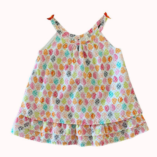 Robe bébé fille Orchestra, imprimé fruits multicolores sur fond blanc, nœuds sur les bretelles et boutons au dos, taille 6 mois.