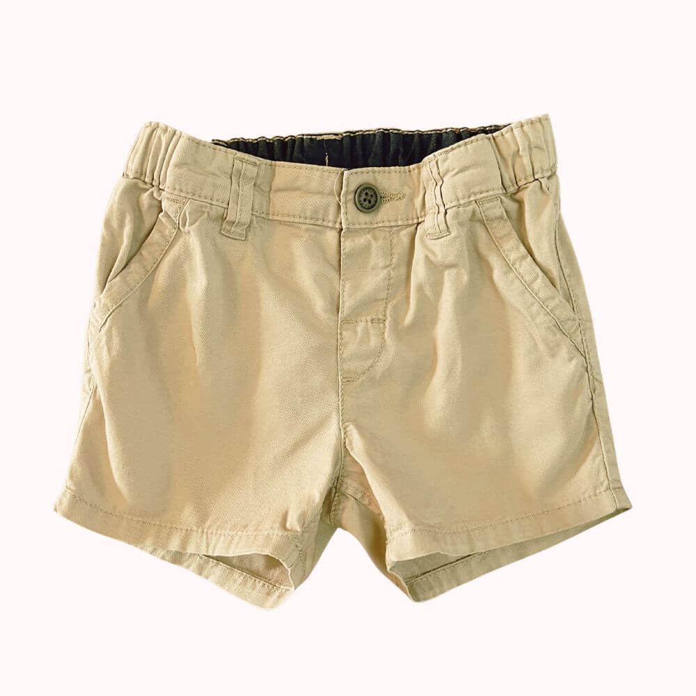 Short écru H&amp;M, 12 mois, en coton avec taille ajustable par élastique intérieur, poches latérales et fermeture bouton.