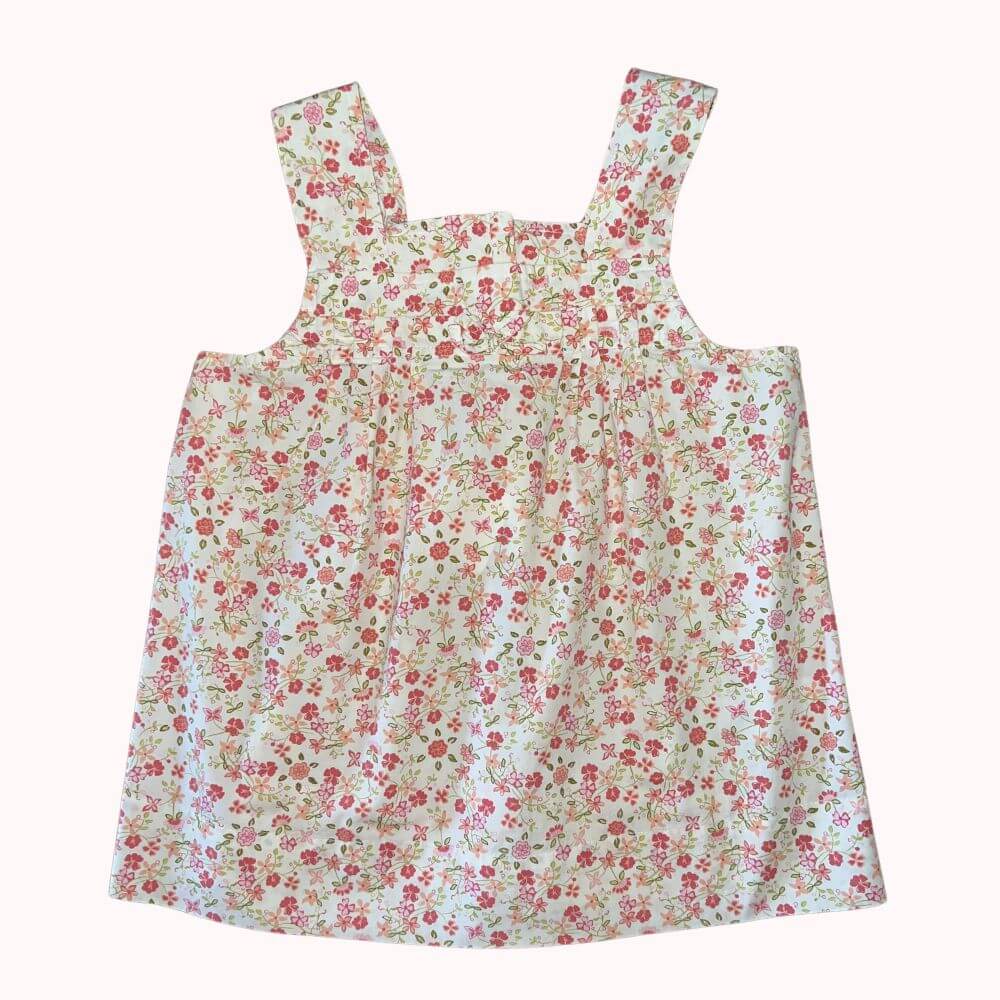 TOP À FLEURS ROSES SUR FOND BLANC , BRETELLES LARGES , PETIT NOEUD DEVANT 10 ANS