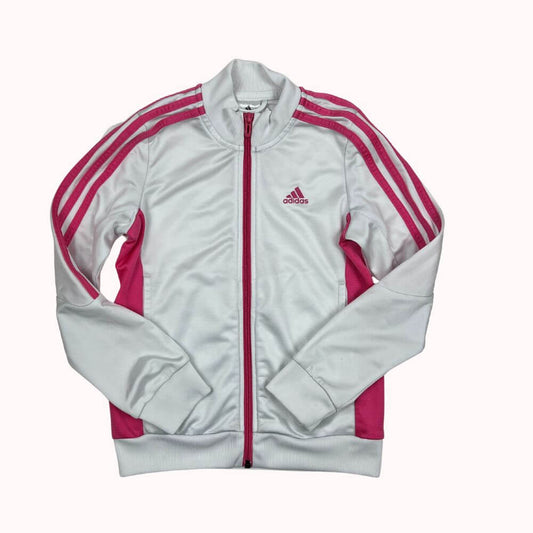 Veste Adidas blanche et rose, avec fermeture zippée, bandes iconiques sur les manches et logo brodé sur la poitrine. Petite tache discrète.
